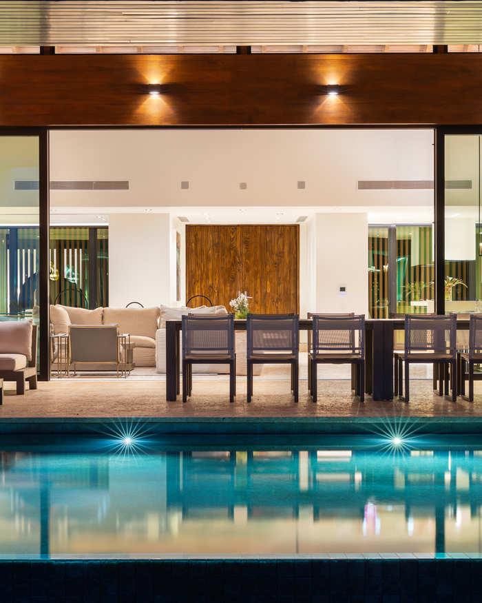 Luxury villa pool terrace at dusk, British Virgin Islands